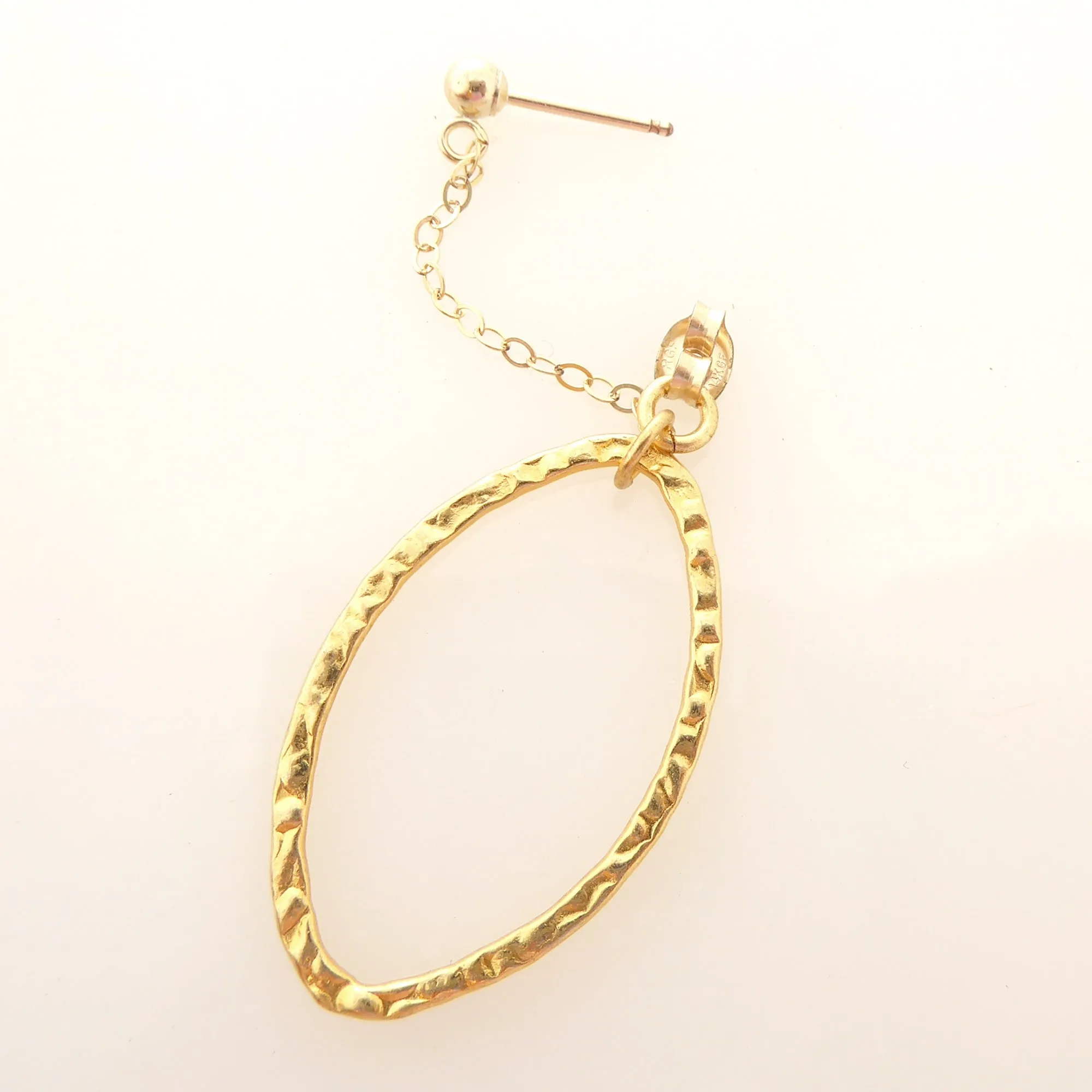 Gold saturn earrings in hammered